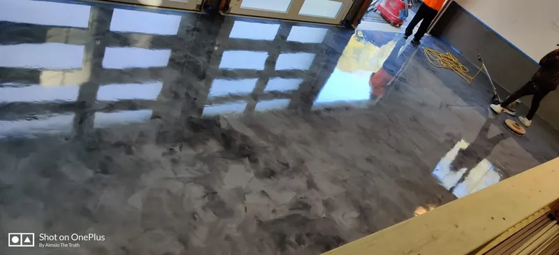 Metallic epoxy flooring in garage by The Concrete Makeover