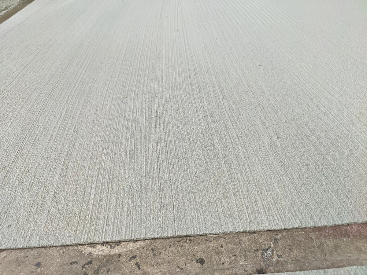 Clean broom finish concrete overlay texture close-up