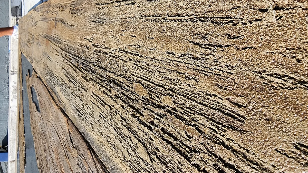 Extreme close-up of realistic wood grain texture in concrete overlay