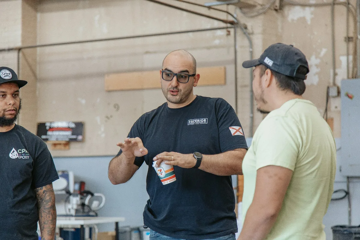 Alessio Trabelsi teaching concrete overlay techniques to students